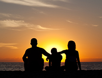 Young Family on the Beach at Sunset